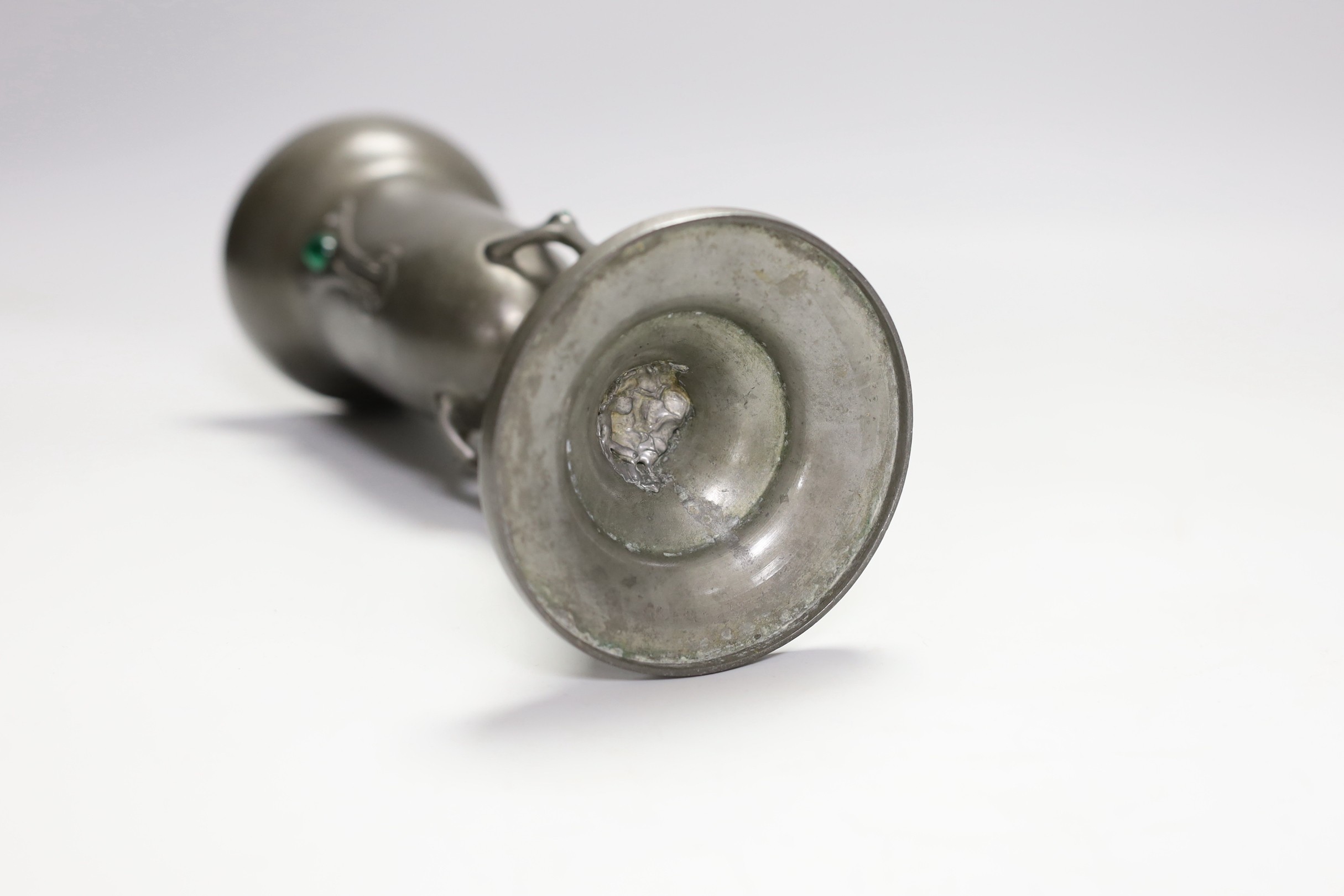 An Art Nouveau pewter vase with glass inset cabochon, 23cm